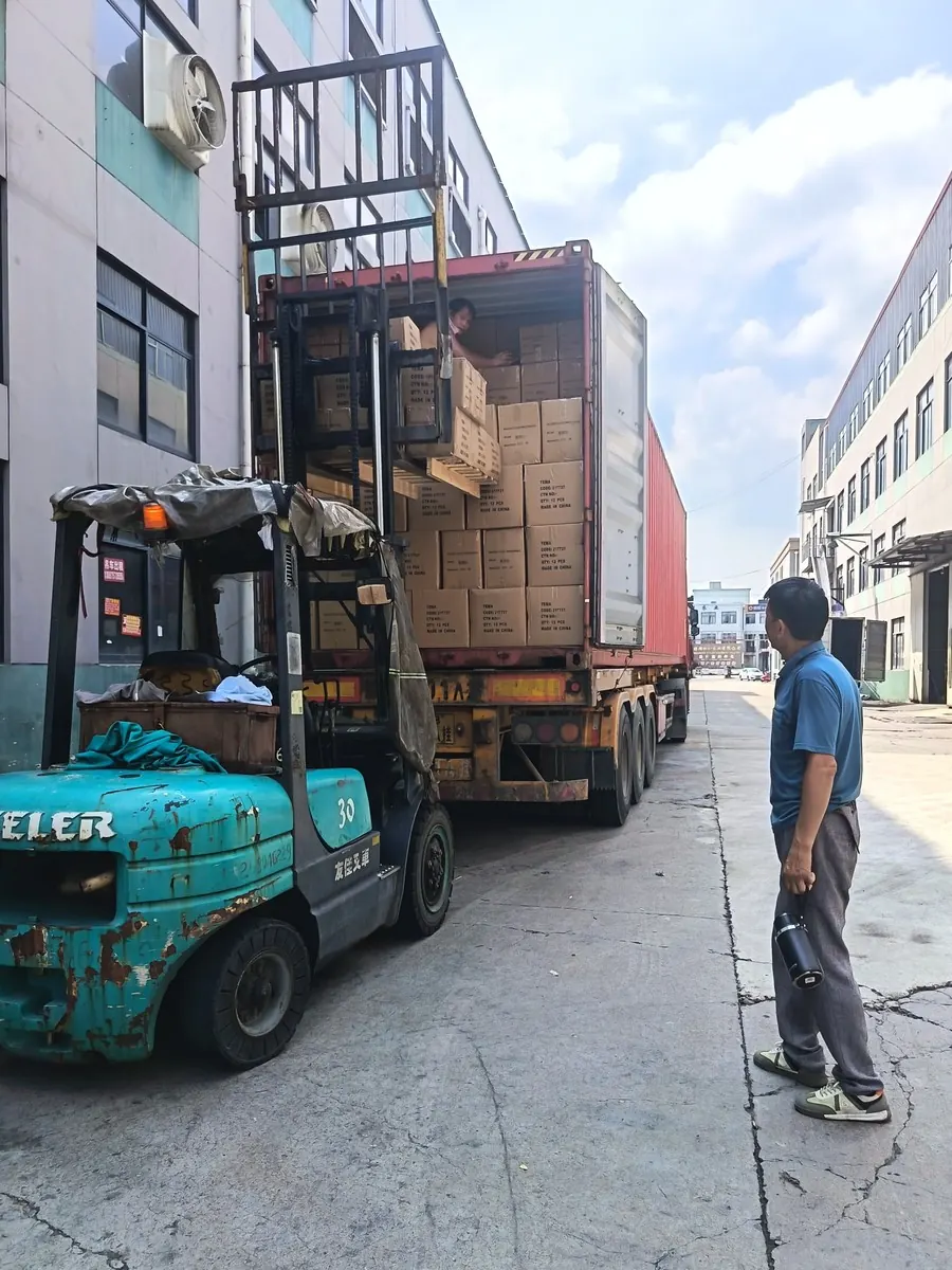 Forklift loading cartons of finished curtains into a container at Xinlan