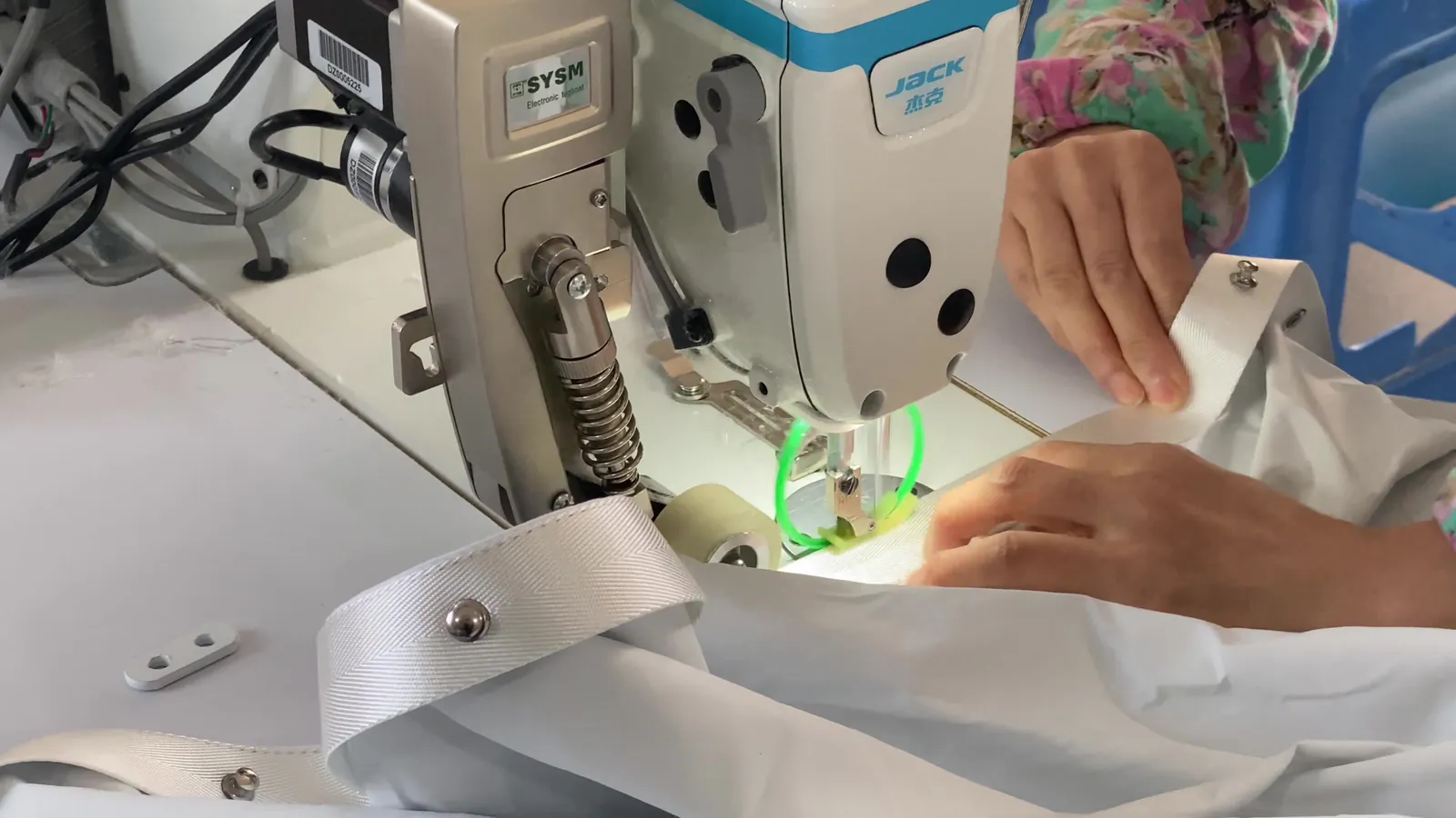 Sewing grommet heading tape onto a curtain panel