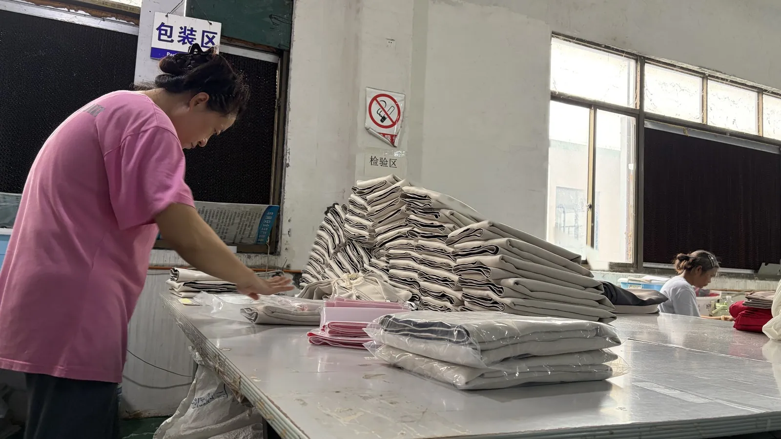 Finished curtains folded and checked in the Xinlan packing area