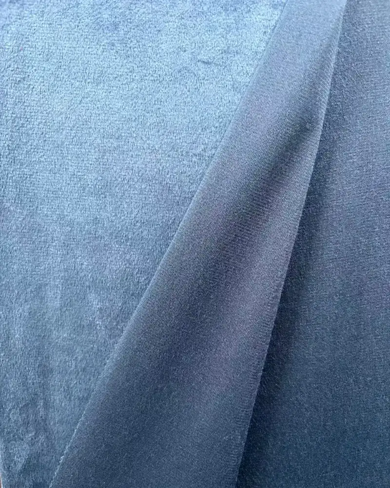 Velvet curtain fabric folded to show face and reverse